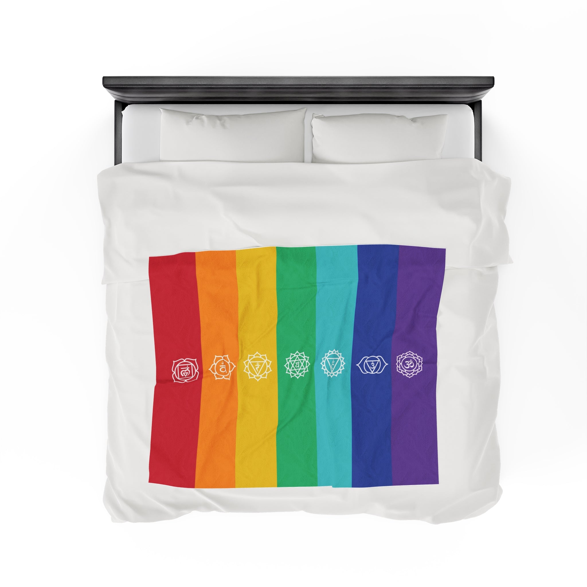 Top view of the 7 Chakra Healing Blanket on a queen-size bed, showcasing its actual size and vibrant chakra color design for holistic healing.