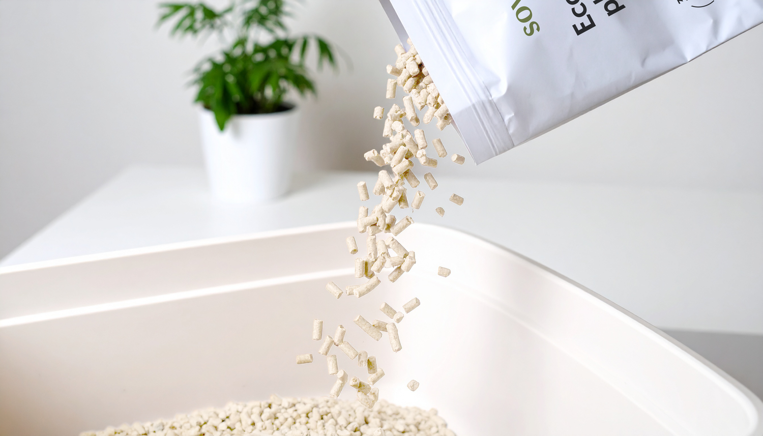 SoyKitty’s eco-friendly clumping cat litter being poured into a clean white litter box